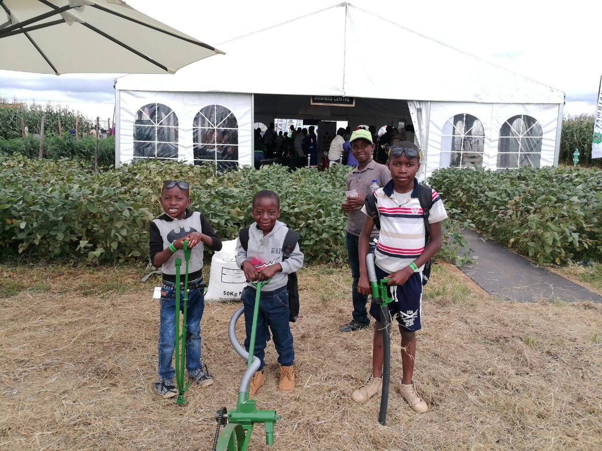 Some young visitors to <a href="/Agritech_Expo/">Agritech</a> #Zambia show off Michris Janse van Rensburg's implements for small-scale farmers. Click on this link to read more about his equipment: bit.ly/2Gjj4Uo Photo: Supplied