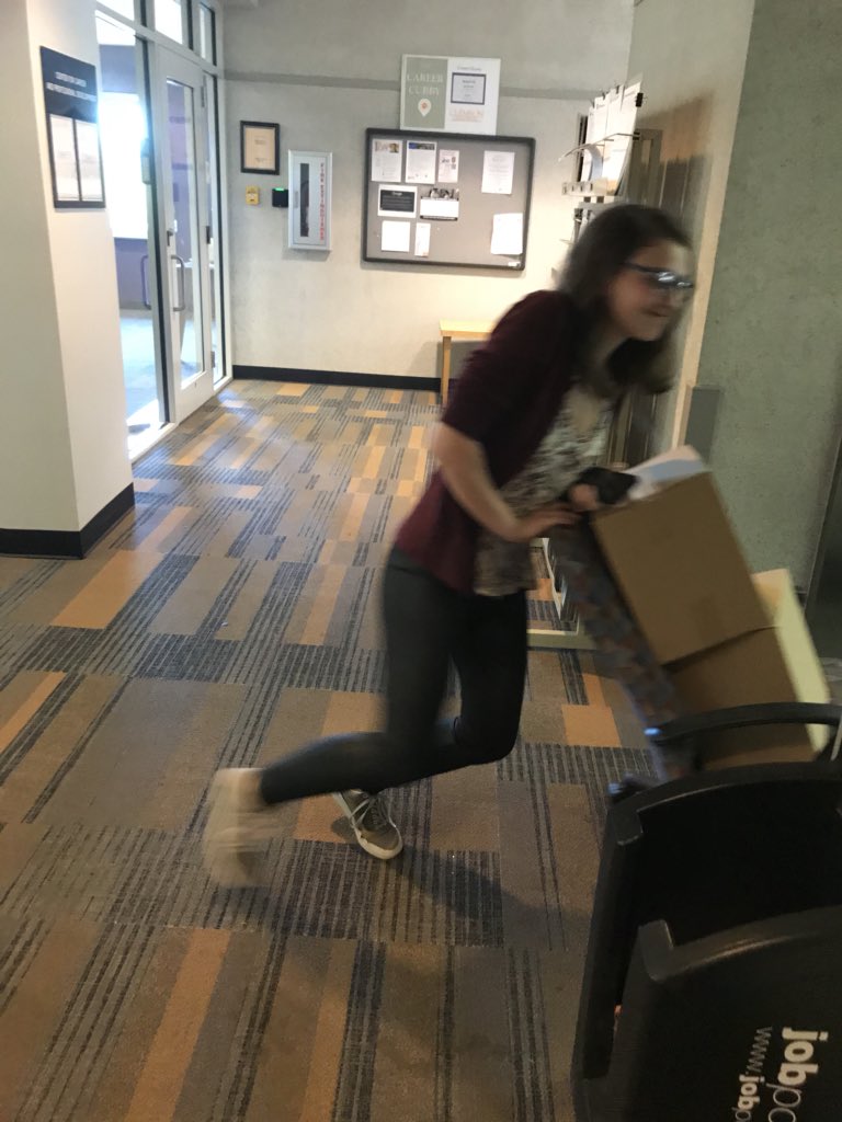 cuchronicle's tweet photo. When you may or may not have misplaced your rolling cart so you use a chair for distribution instead. Find us on Library Bridge TODAY!! https://t.co/UB6Qhbs2DU