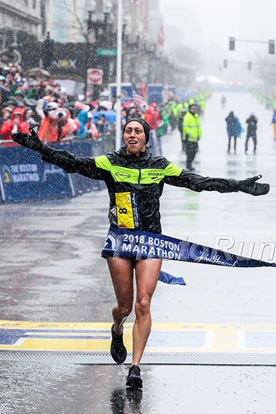 RunBlogRun's tweet photo. Desi Linden savoring her hard won victory in @Bostonmarathon on Monday. @desi_linden is wearing a prototype Brooks racing shoe. It has no name as of yet. Elite athletes test shoes for their brands, and this one passed with flying colors, #runhappyBos, #runblogrun, @theshoeaddicts https://t.co/yt2bQVVxUN