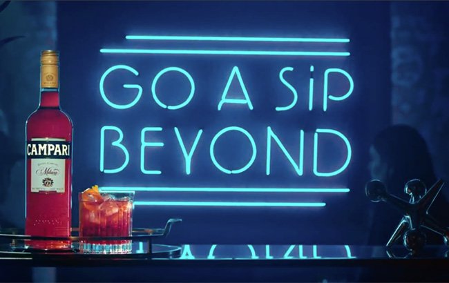 spiritsbusiness's tweet photo. It takes three sips to fall in love with Campari, according to the brand's latest campaign https://t.co/6Dd0MTSpK7 https://t.co/QZKSP2gEc7