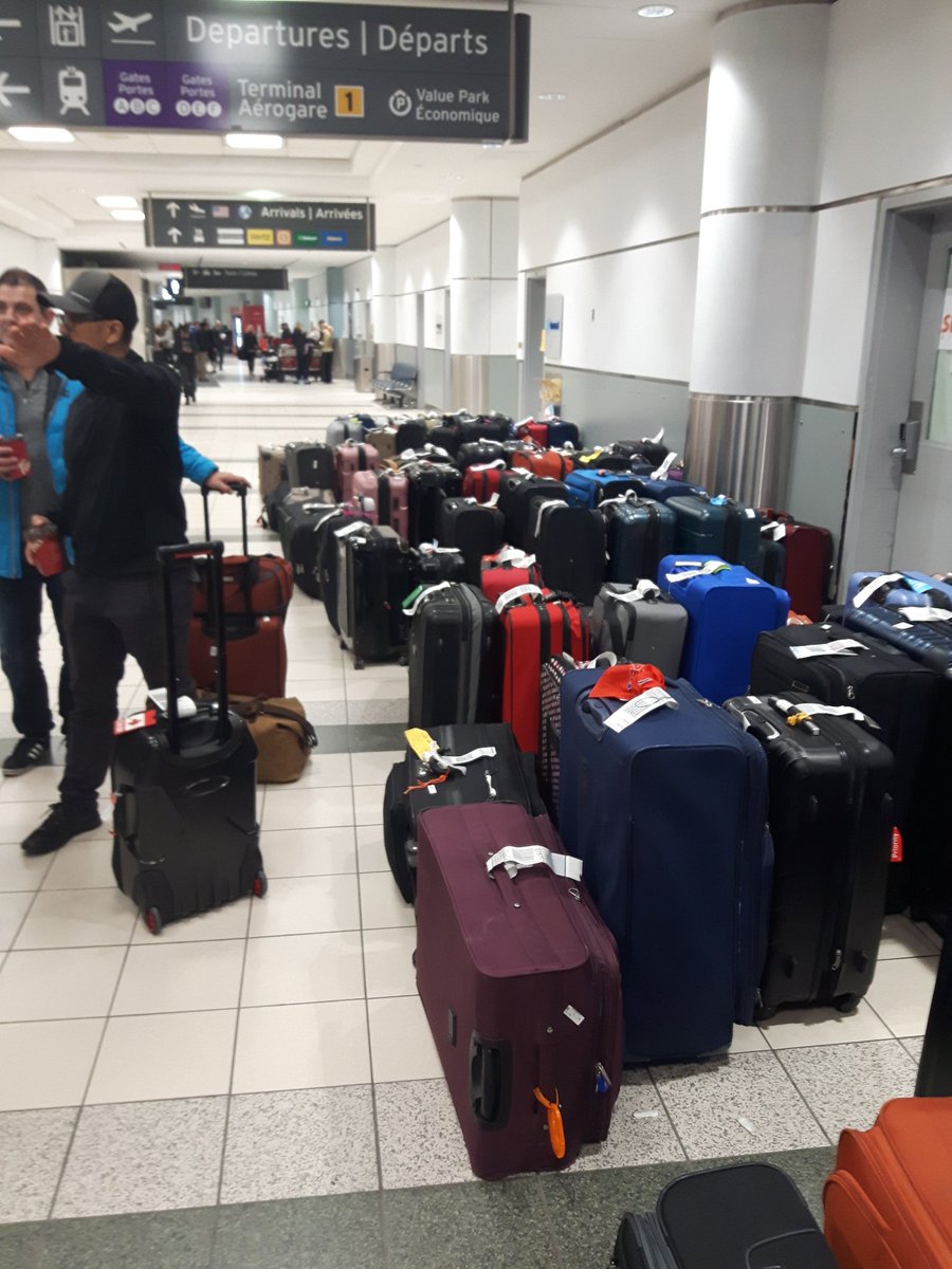funrobbie12's tweet photo. @eyemsocalm was on flight730 after 14hrs of delay we cancelled our trip and requested a credit.. foreseen these issues would continue for the next few days... in the hallway to exit airport many bags left unguarded. found several Sunwing customers luggage unattended... wow! https://t.co/7379pN5Aqa