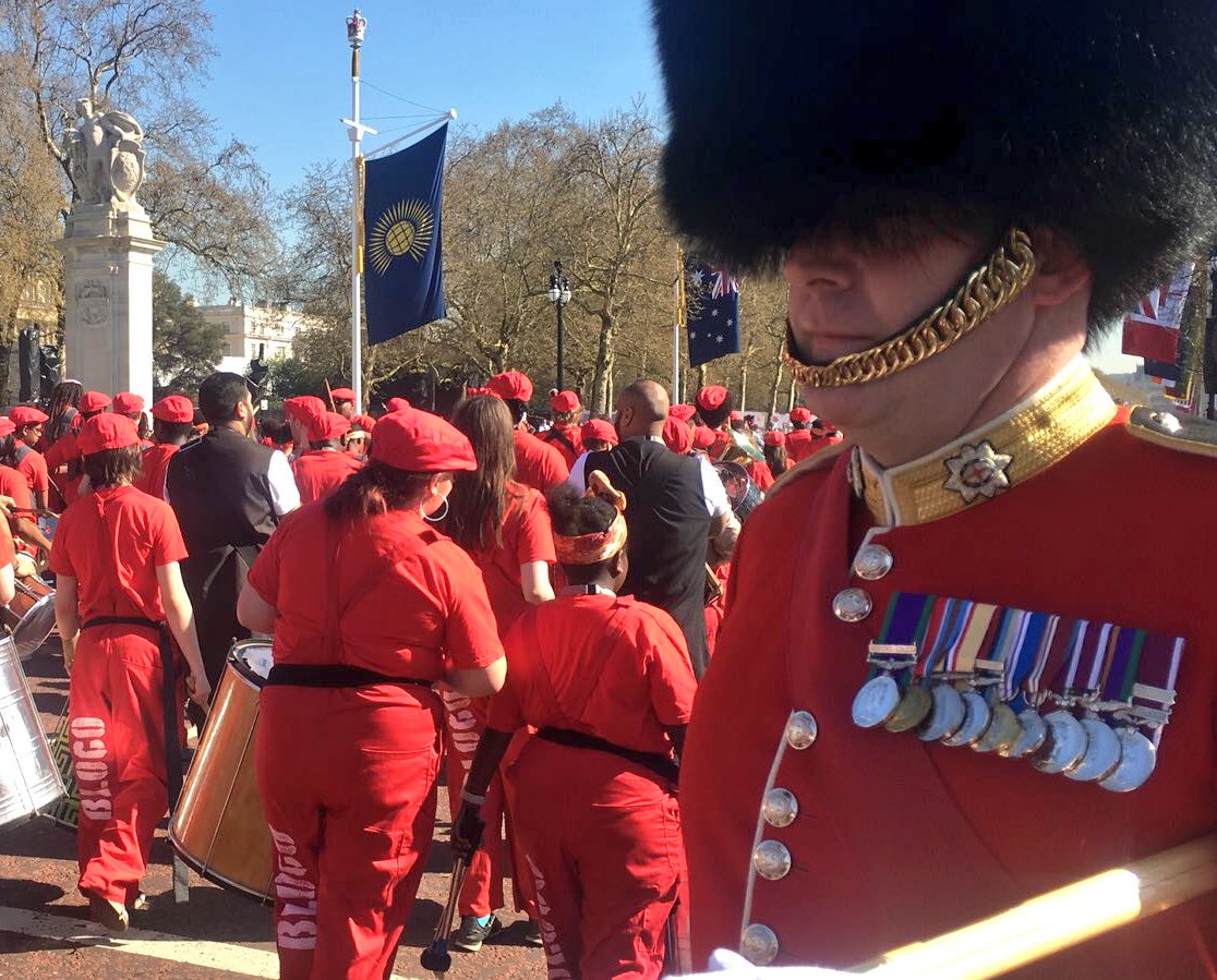 RoyalFamily's tweet photo. Outside Buckingham Palace, Kinetika Bloco and Dhol Drummers perform on The Mall to celebrate the Formal Opening. #CHOGM2018 https://t.co/vhVBOarKDn