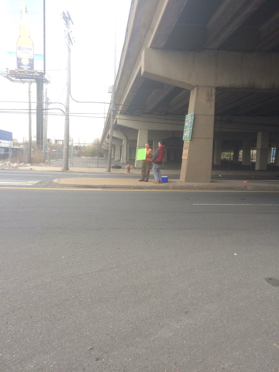 Oregon Ave safety committee members holding up sign to remind drivers to have proper space cushion