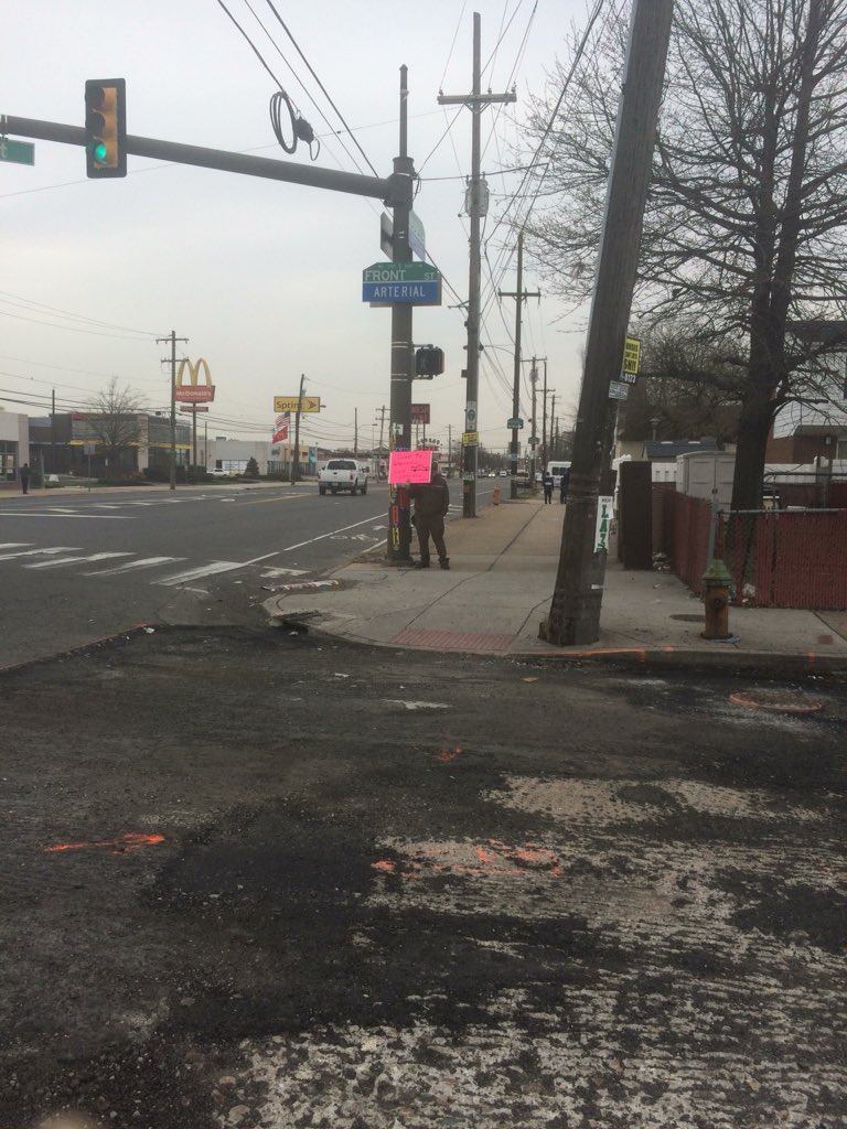Oregon Ave Safety committee members at intersection of Front and Oregon informing drivers to clear intersection by looking left, right, left