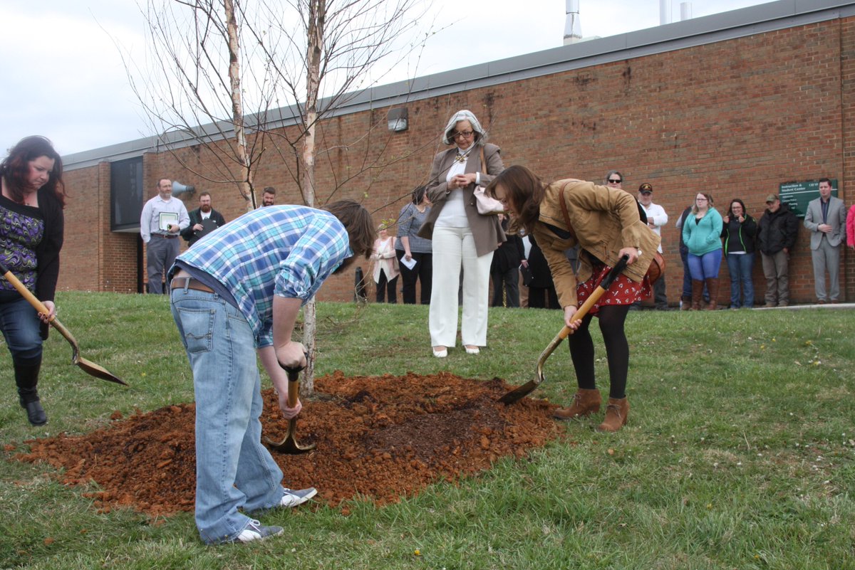 VHCC's tweet photo. Campus employees honored Phil Ferguson, a dedicated faculty member who lost his hard-fought battle with cancer earlier this year, by planting a birch tree in his honor on Thursday. His wife, brother and sister covered the roots with soil. RIP, dear friend. #myvhcc https://t.co/KiIlZP8eBI