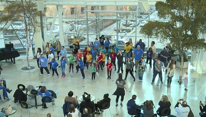 Families come together to participate in a flash mob to raise awareness for World Down syndrome Day. ow.ly/hExC30jwkQj