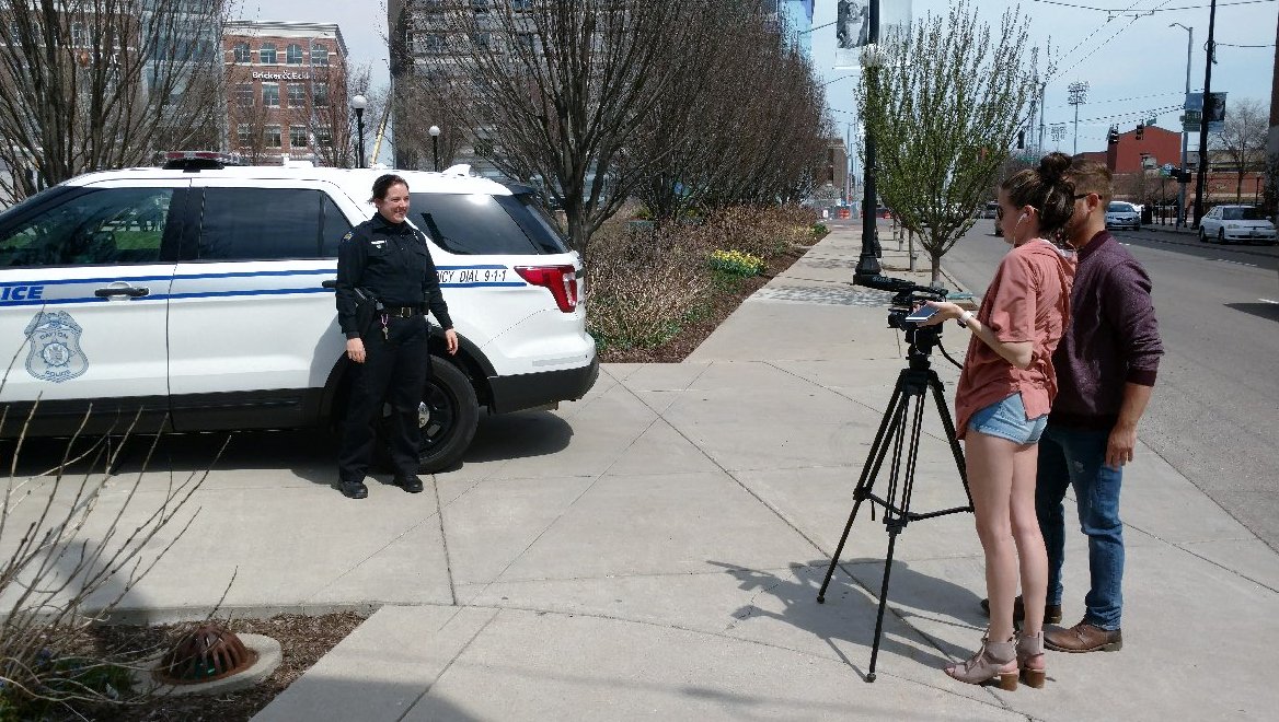 DaytonPolice's tweet photo. Off. Hamilton participating in a #WrightState student's #TimelessKindness project. The students were interviewing various folks about why kindness is important. We're looking forward to seeing their finished product. https://t.co/ezlHbu75yI