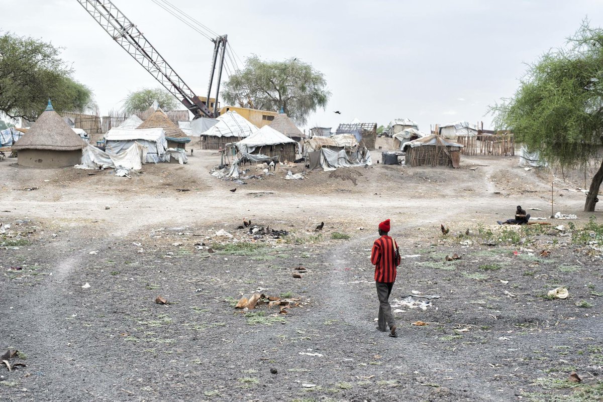 JDF_Voice's tweet photo. An enormous construction crane in the middle of a South Sudanese village tells the story of a land whose building was interrupted by war. When fighting broke out, equipment like this was abandoned where it was, and sits there to this day. https://t.co/xSYovHdkTw https://t.co/BVUx76VZNh