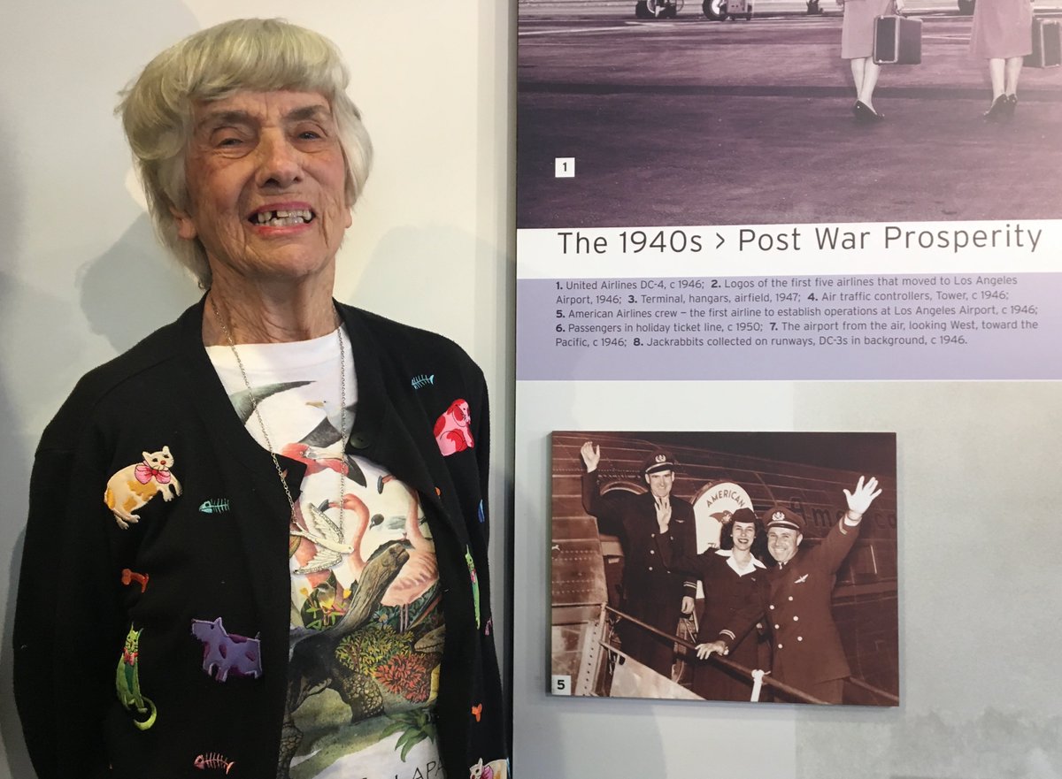 flightpathlax's tweet photo. It is rare to actually meet someone in an historical photo on the Museum Timeline but today was that day! Joyce Newhall, a flight attendant for @AmericanAir from 195 -1957, posed next to the photo of her from the 1950s. Stop by! Free admission Tues-Sat 10am-3pm #flightpathlax https://t.co/bWCCHAgQ2g