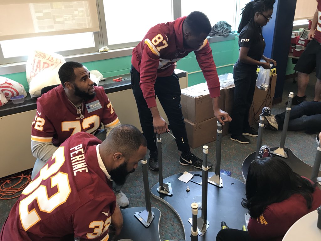 Commanders's tweet photo. .@DaleJr &amp; #Redskins players out here @LBECDC building a brand new library space for students with @RedskinsCR, @tdjf &amp; @HeartofAmericaF! #READesign #RedskinsGiveBack https://t.co/cXlpAUKLOv
