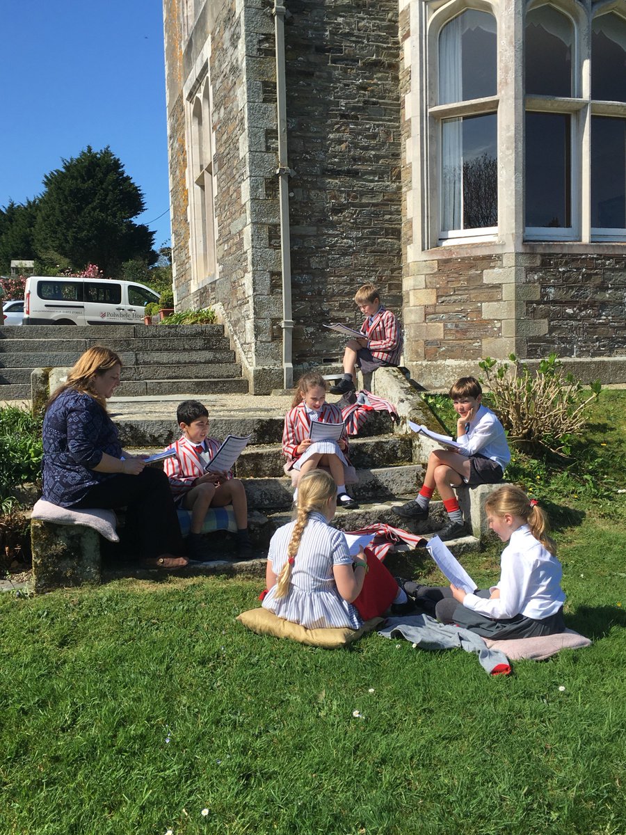 The children making the most of the sunshine, enjoying a music lesson outside. #schoolmusiclessons #polwheleinthesunshine