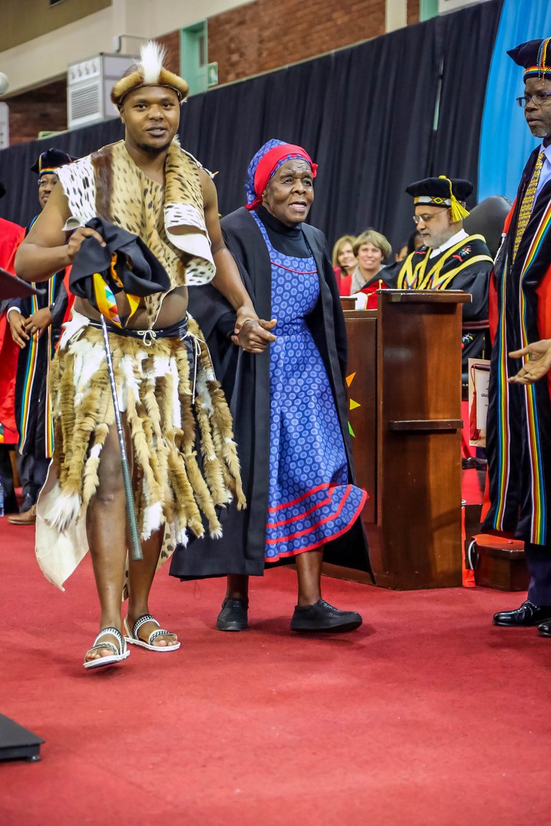 The School of Law Graduation was agog this morning when Bachelor of Laws graduate, Njabulo Ntombela sporting ibheshu (Zulu traditional dress) took off his graduation gown and draped it on his great grandmother, Ms Nomkikilizo Ntombela (89). 
#UKZNgrad2018
