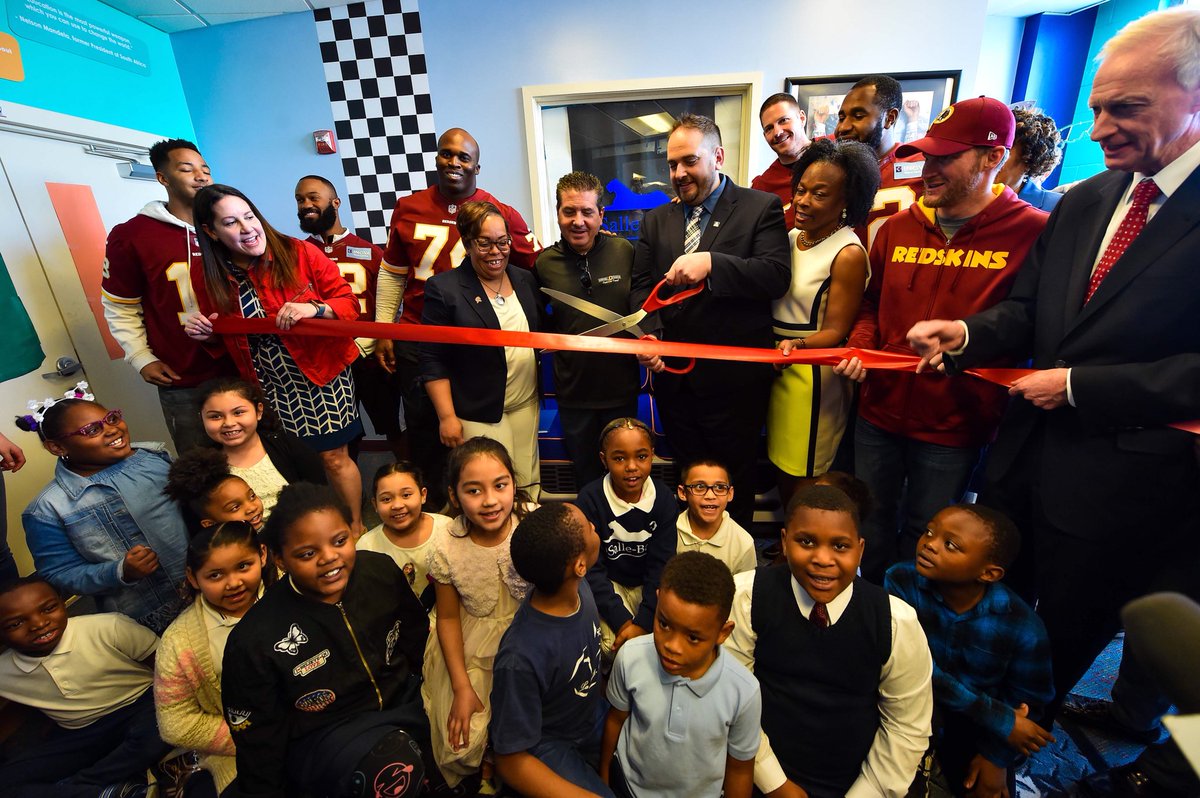 Commanders's tweet photo. All smiles at the @RedskinsCR library #READesign today to build a brand new library space for D.C. students with @tdjf and @HeartofAmericaF. @LBECDC was selected for this project due to their commitment to literacy in the 2017 – 2018 #RedskinsRead Program. https://t.co/zmHpPWFxbV