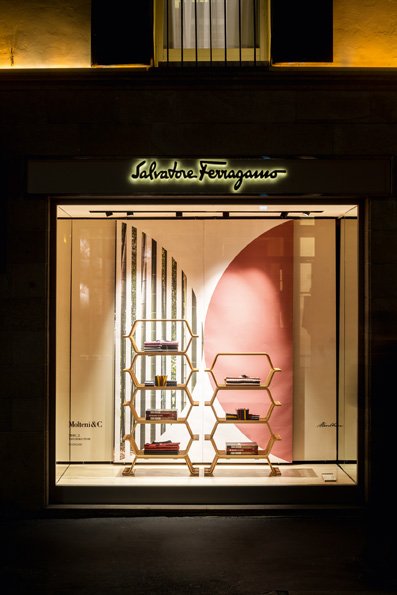 Ferragamo's tweet photo. Until April 22nd, the store windows on Via Montenapoleone in both the Men's & Women's boutiques are dressed for #milanomodadesign week featuring the Hertiage Collection by @MolteniDada. https://t.co/9zkhgoi7d7