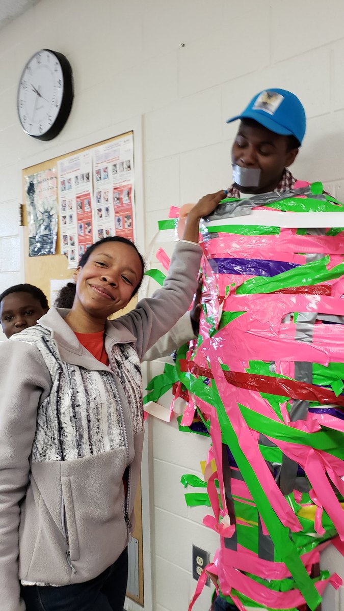 apsBAMOAcademy's tweet photo. Part 3: faculty joined in to make sure things were secure 😉 for @jbradfordco & @Robinviews pink&green tape but someone added red and white!! @pointsbyPortee @ReadwithLee @TuttleTips @DrEmilyAMassey @apsupdate #apsmedia #ReadingGoalsMet https://t.co/3xONzeUYmb