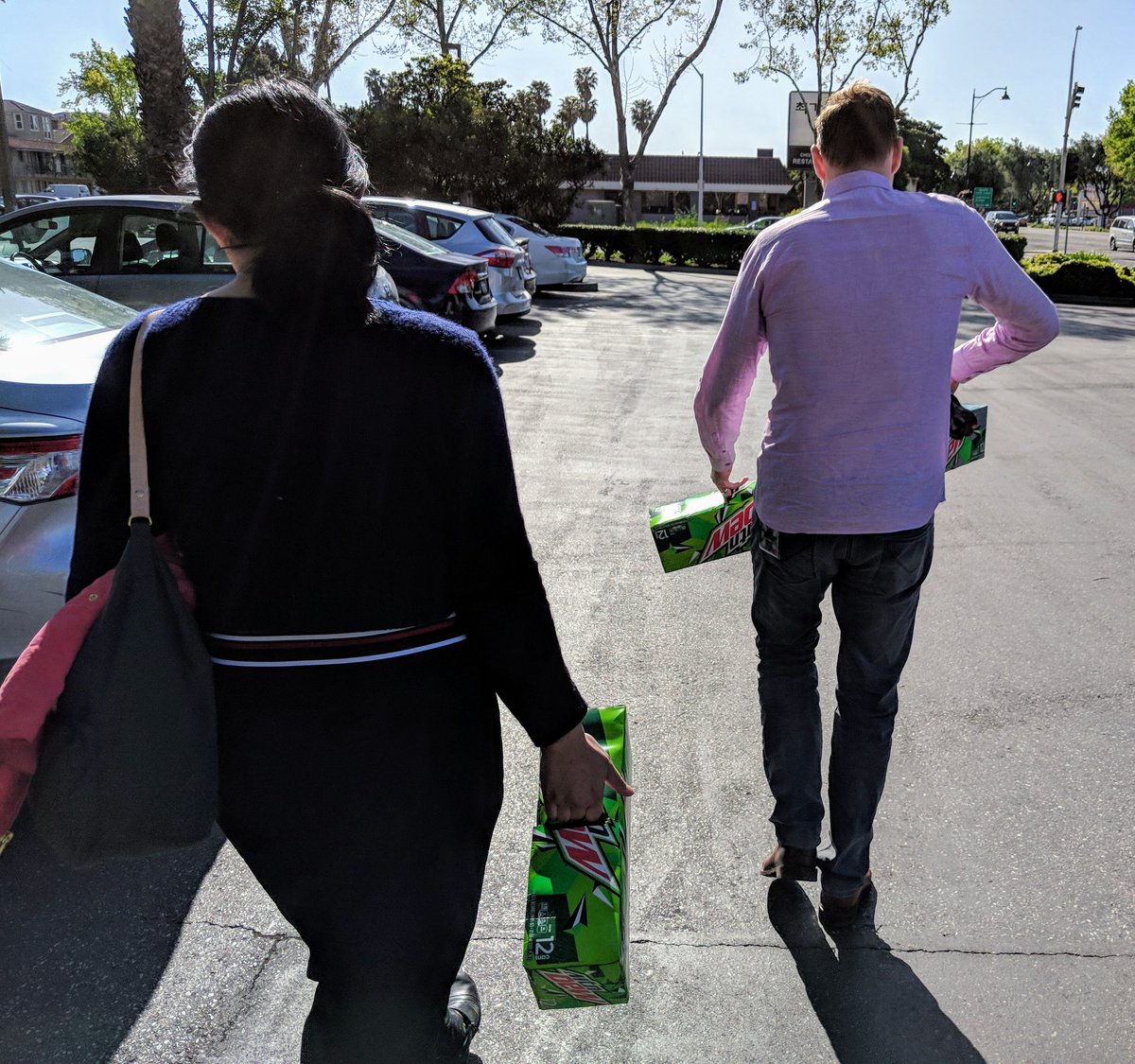 Alex and Mariko carrying Mountain Dew