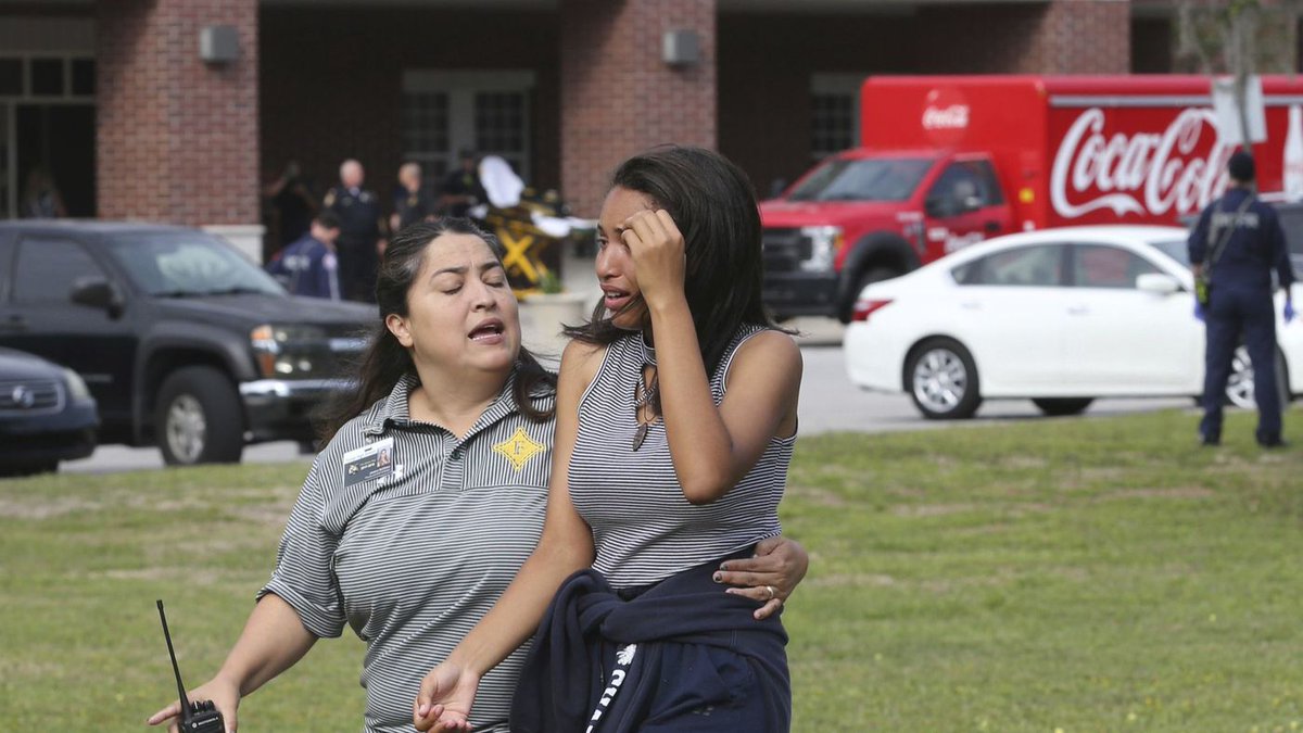 latimes's tweet photo. Panic and fear gripped another Florida school Friday when a gunman opened fire, wounding one student before being taken into custody on a day planned for a national classroom walkout to protest gun violence https://t.co/BebUsezjsS https://t.co/cv2k86VAwe