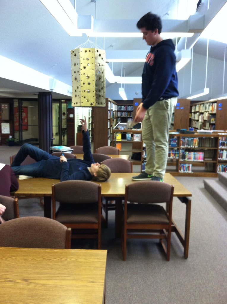 Librarystm's tweet image. Allison Thomas&apos;s art students hanging this awesome installation that was designed using our school&apos;s laser cutter