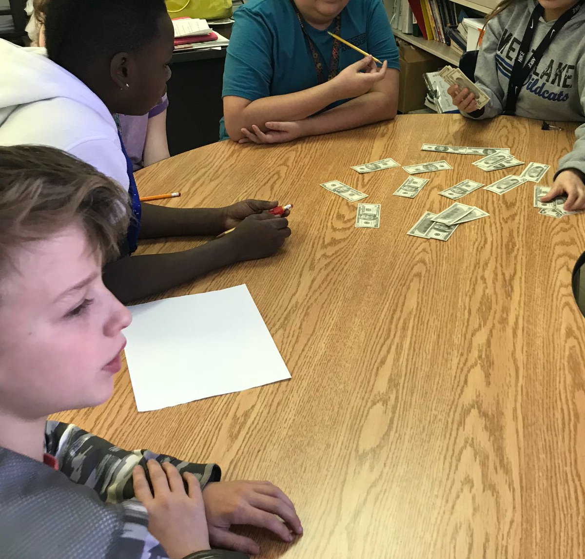 We gave the students 932 dollars to split evenly among their group of 5. They came up with many different strategies but kept ending with a pile of money left over 🤷‍♀️Finally, they realized long division was the best way to solve! #handson #FUNctionalfriday #weare44