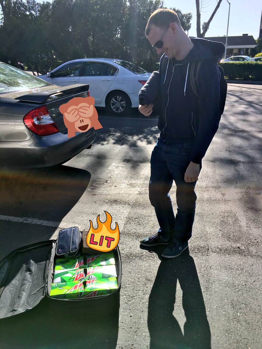 Jake looking at his suite case full of Mountain Dew.