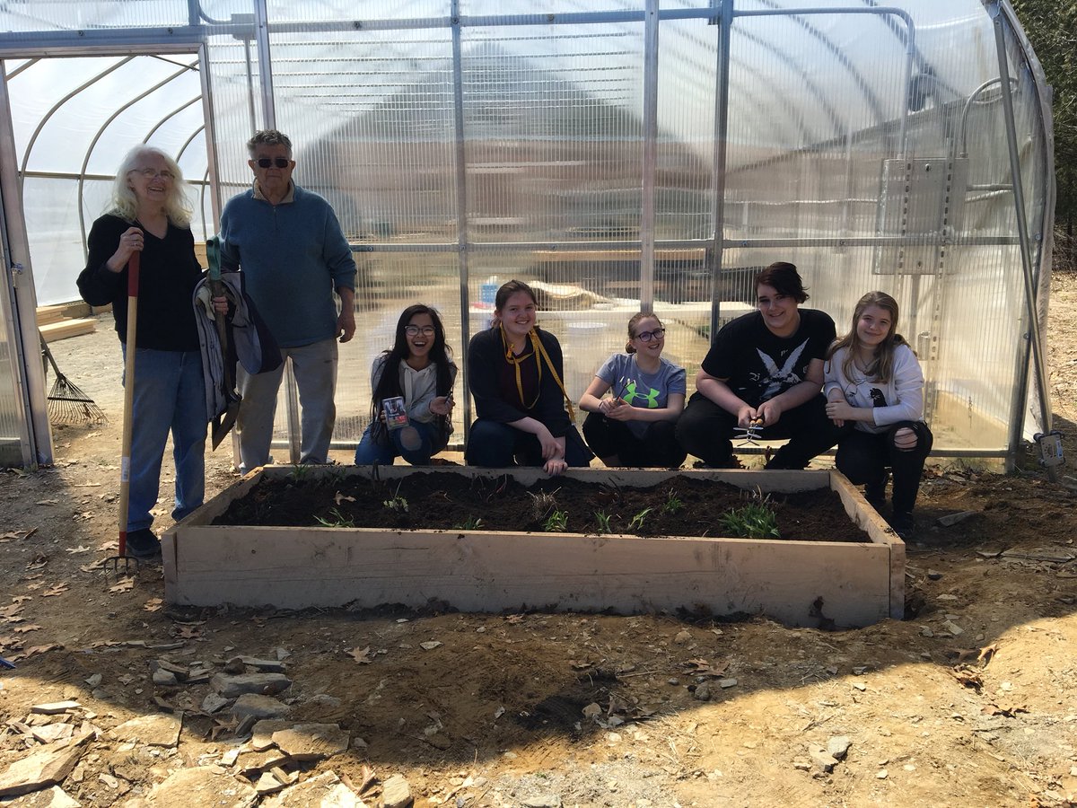HBMSGreenhouse's tweet photo. Green Group worked hard today building and planting a new bed outside of the greenhouse! Thank you Tom and Brenda from the UNH Master Gardener program for all your help! Happy Earth Day! #hbmsgg https://t.co/Q2r04JrTsm