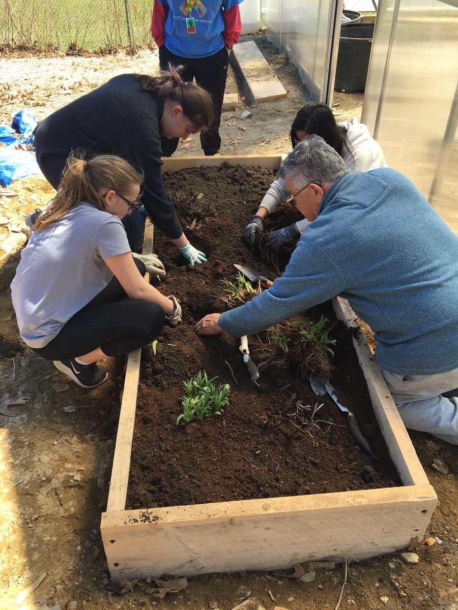 HBMSGreenhouse's tweet photo. Green Group worked hard today building and planting a new bed outside of the greenhouse! Thank you Tom and Brenda from the UNH Master Gardener program for all your help! Happy Earth Day! #hbmsgg https://t.co/Q2r04JrTsm