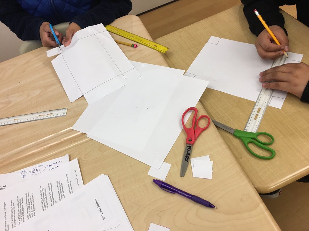 c_hansen21's tweet photo. Hands on math today with a Maximizing Volume activity! We predicted that cutting smaller squares out of the corner would lead to a higher volume for our popcorn containers. #WeAreHB #HBMSPride #engageHB https://t.co/KuFQgGLRNK
