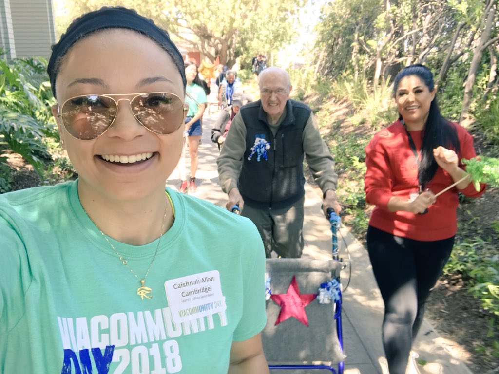 TweeterlessCass's tweet photo. Today was @Viacommunity day where we spent the day volunteering and I got the pleasure of meeting Ray and pimpin’ out his walker💚 He also loved @FollowErin #ViacommunityDay #ParamountGivesBack https://t.co/jLLWGb3Qa8
