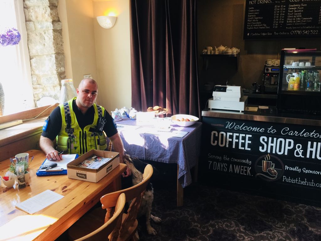 PCSO3810Simon's tweet photo. Currently at my drop-in surgery at Carleton Village Hub. Toby the dog is my first customer! #carletonincraven @umbrella_ccu @Skipton_Police @NYorksPolice https://t.co/yJR7zZJUM7