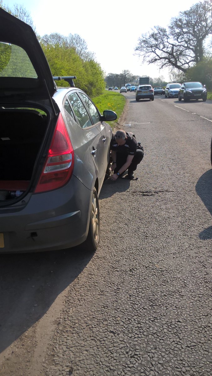 TVP_Bucks's tweet photo. Winslow NHPT doing their first good deed of the day changing a flat tyre on the A421 Nash to help a family get to the zoo. Remember to checks your tyres regularly as this tyre had well past it best and shouldn't have been used.#P7042 #C9327 #fatal4 https://t.co/Sd9iGkv7UL