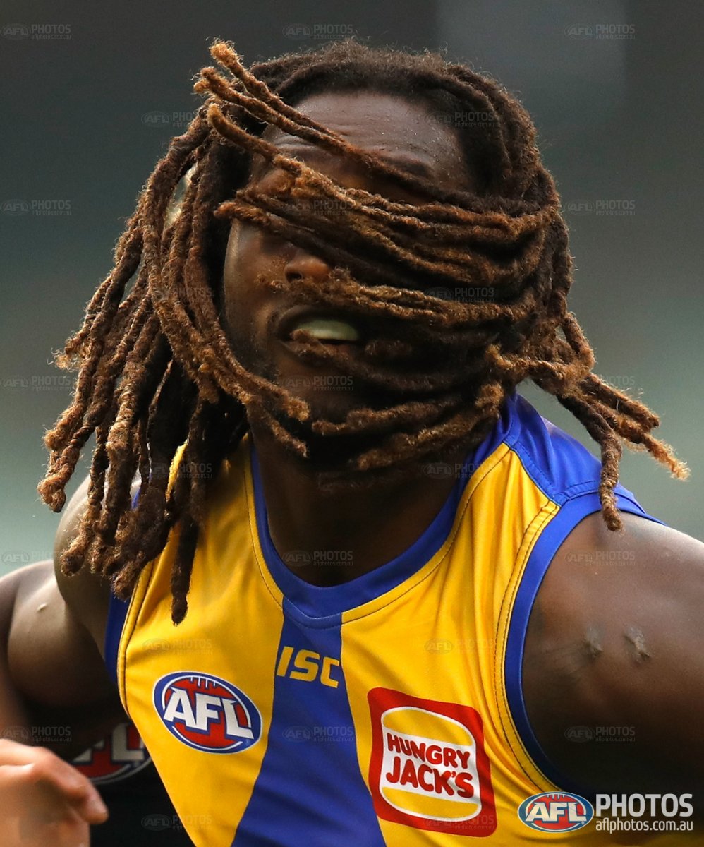 Kicking against the wind <a href="/NicNat/">Nic Naitanui</a> <a href="/WestCoastEagles/">West Coast Eagles</a> #AFLBluesEagles commercial.aflphotos.com.au/photography/re…