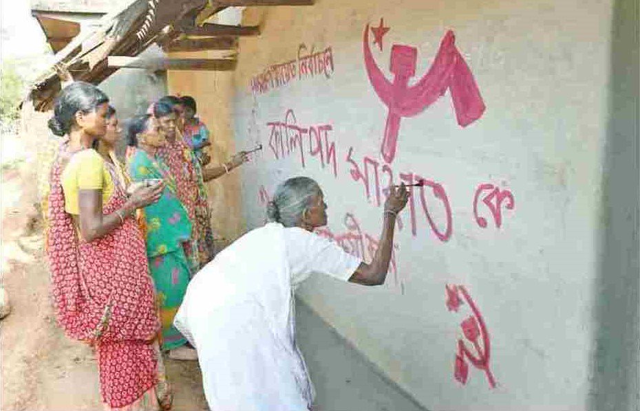 cpimspeak's tweet photo. Chitamani Saren does wall writing for Left Front candidate for  the Panchayat Elections at Dharampur, Bengal. Her son, CPIM Member Salku Soren, was abducted by Maoists from his house &amp; murdered in 2009. Such was the fear then that villagers refused to take his body for funeral. https://t.co/kz5enHUfq9