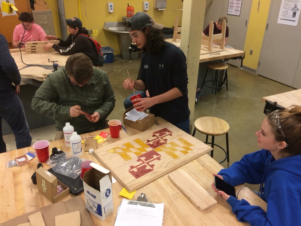 therealmrrudd's tweet photo. Wood 3 students learning how to use our Xcarve from @Inventables and colored resin epoxy to replicate the MD state flag on a blanket chest top! #FCPSCTE https://t.co/bYqeuvSFak