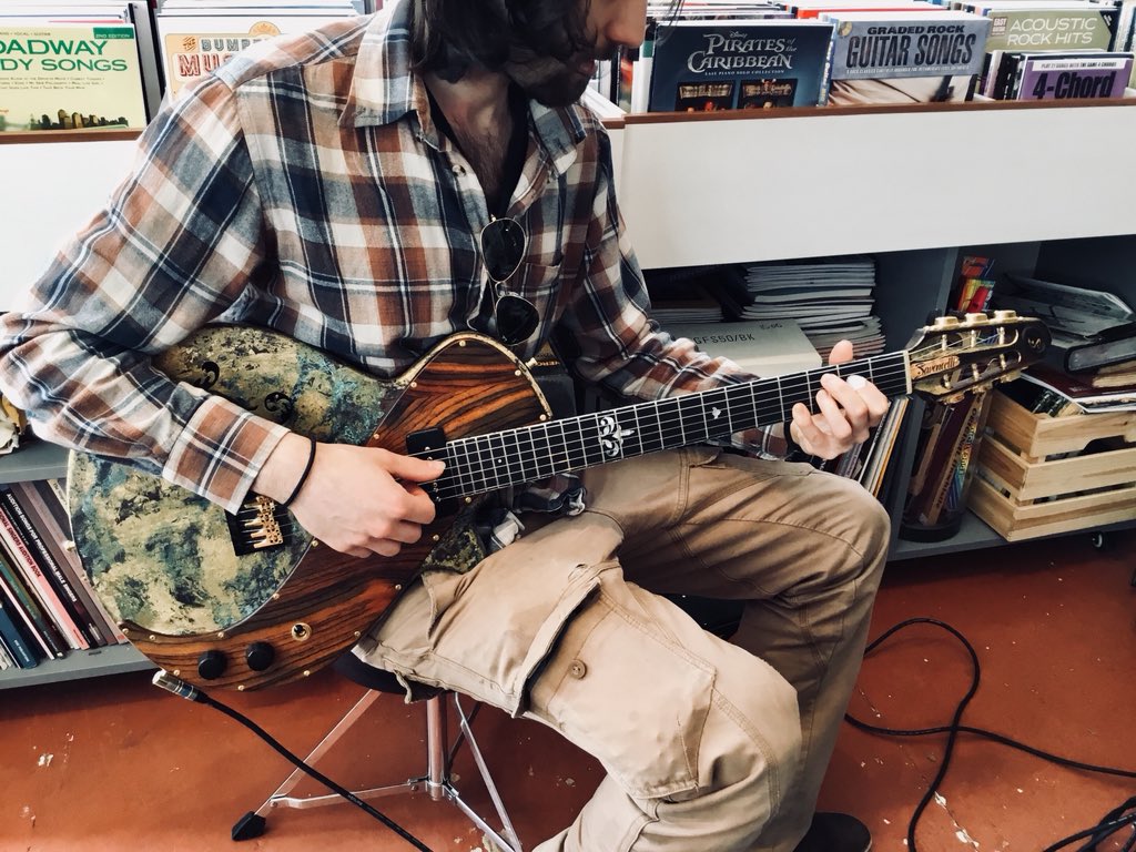 dotsmusiccamden's tweet photo. A new addition to the gallery of hand built guitars by @ESavoncelli , in the hands of it’s creator. #RSD2018 #camden #muswellhill https://t.co/BDl5XvFWQU
