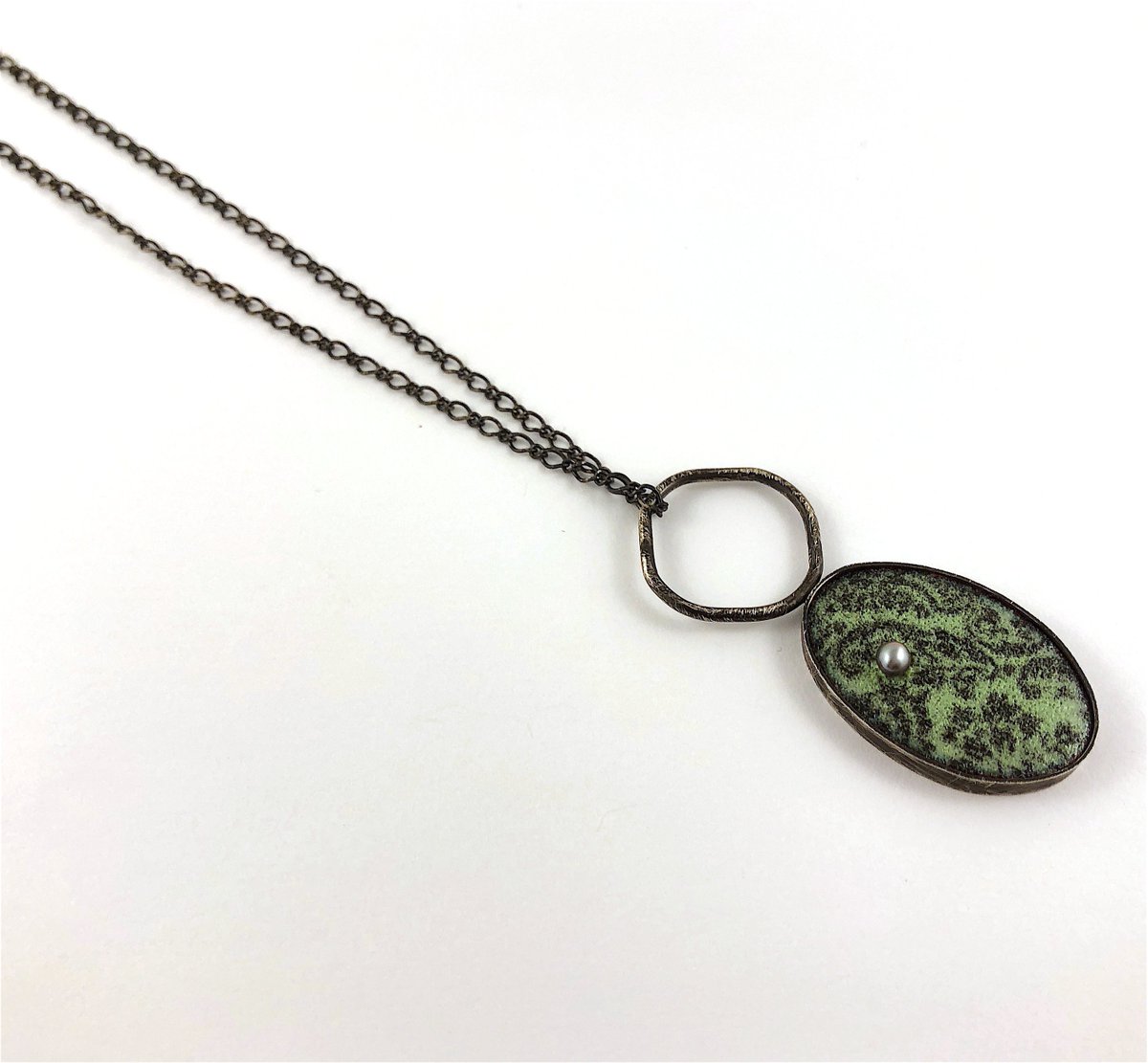 patsykaykolesar's tweet photo. New one-of-a-kind enamel necklace. Made from sterling silver that's been blackened, vitreous enamels and a grey freshwater pearl. This might be my new favourite? I also might say that about all of my new pieces ;) https://t.co/bIKVIQqgjs