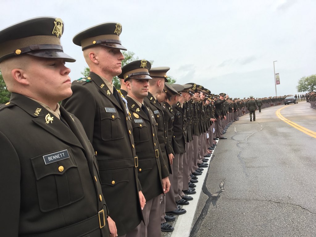 Cadets standing in a line along the road
