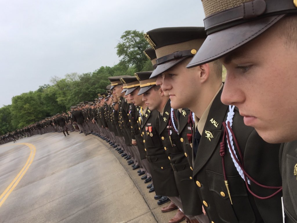 Cadets standing in line along the road