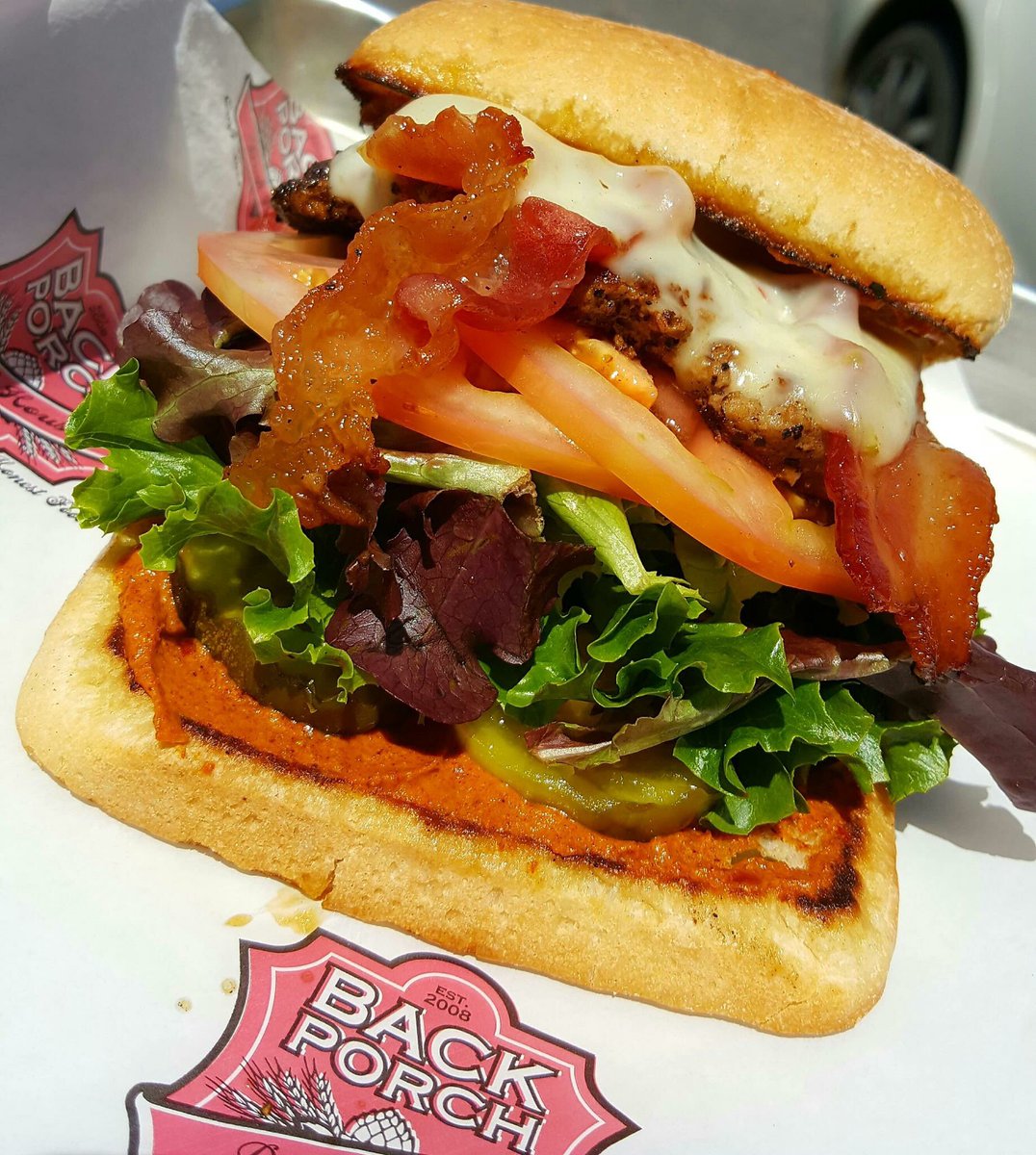 BackporchT's tweet photo. Raginโ Cajun!
Two grilled chicken tenders, bacon, pepper jack cheese, spring mix, tomato, pickle, and Cajun ranch mayo on toasted ciabatta! Wash one down today with a Southern Star Half Nelson American IPA!๐ป #BackPorchDraftHouse #ragincajun #southernstar https://t.co/oN2DRvfuoE
