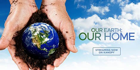 a photograph of a man's pair of hands holding an image of the earth against a sky backdrop