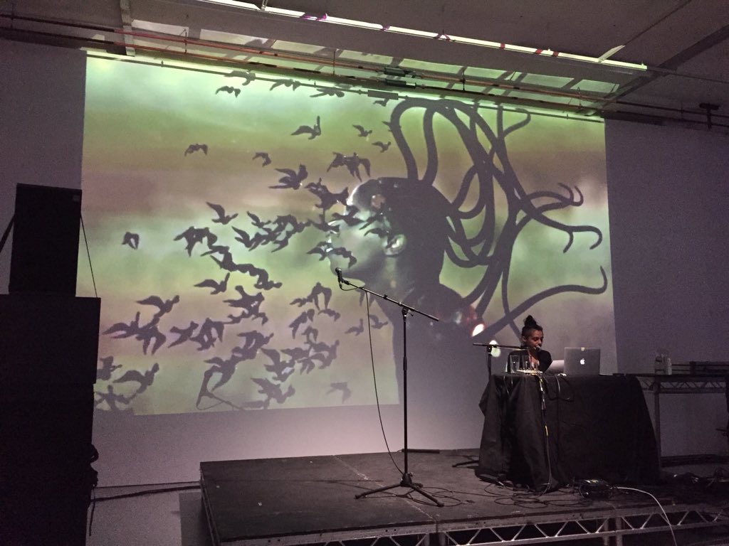 eleni_ikon's tweet photo. Ayesha Hameed‘s excellent presentation of the Black Atlantis - highly recommend checking out the Santigold animation seen here in the background @_SpikeIsland Unsound : Undead #AUDINT https://t.co/eHCk21Bgoj