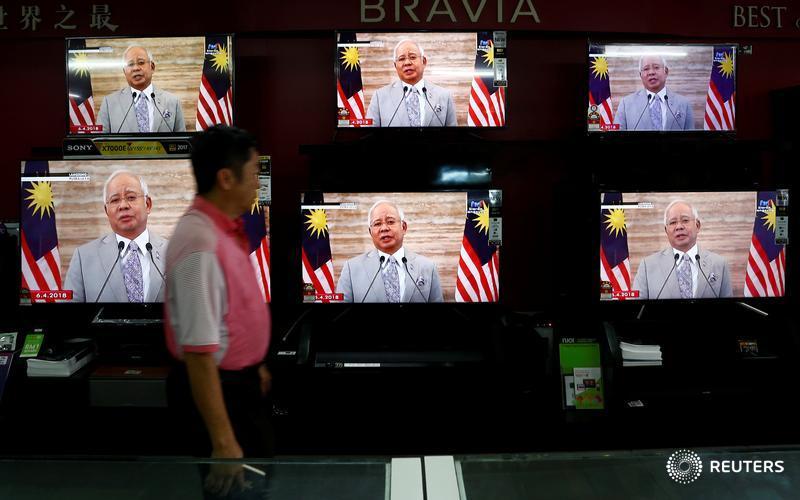 Reuters's tweet photo. .@Breakingviews: How Malaysia’s prime minister may be re-elected despite the 1MDB scandal: https://t.co/ge7F1HAnsB via @ClaraMarquesRTR @ugalani https://t.co/jjIGe8jY9h