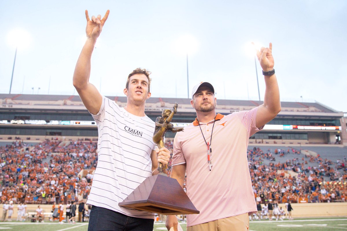 TexasFootball's tweet photo. The Punter. The Coach. The Trophy. 
@CoachTomHerman honors @mdcksn for his @RayGuyAward tonight at halftime. #ThisIsTexas #HookEm https://t.co/4pXyqpFTEJ