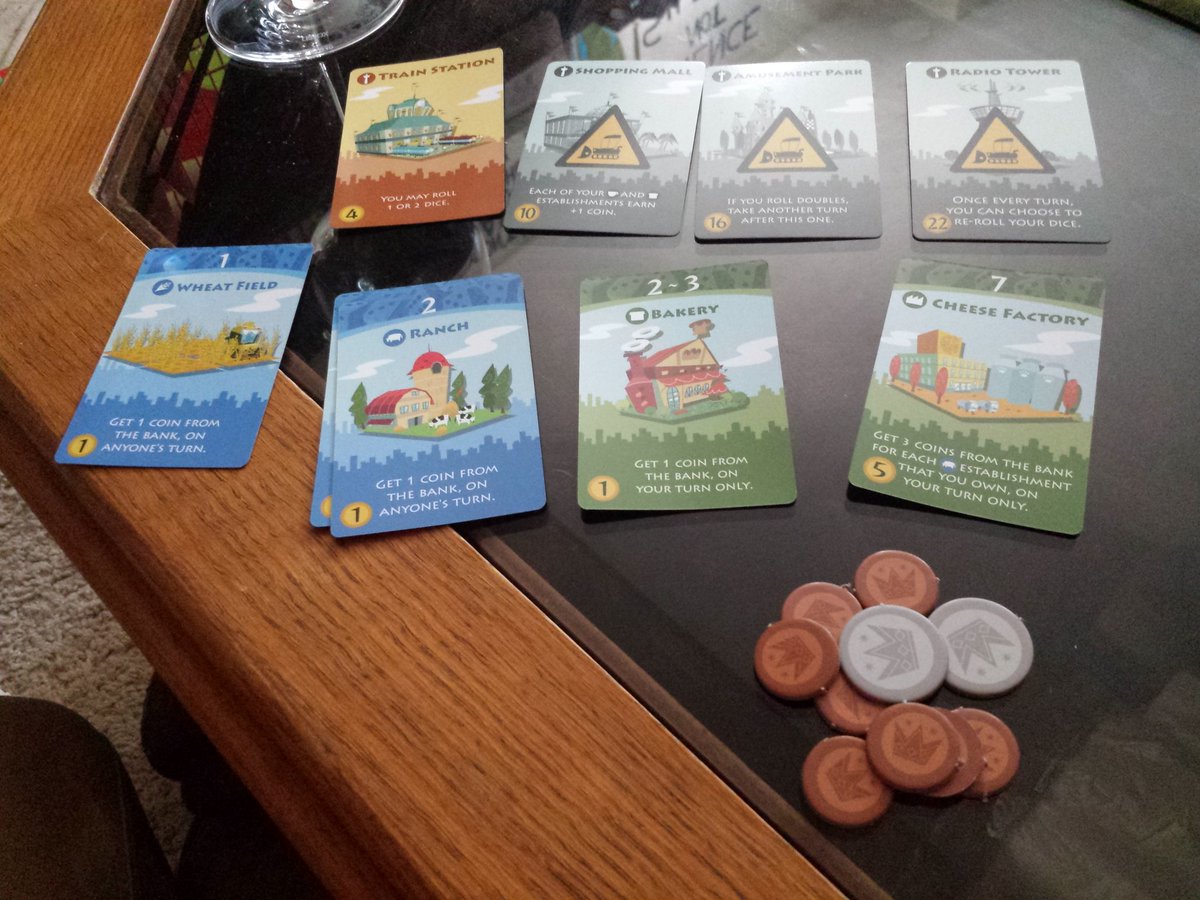 DinaaoMeeples's tweet photo. Round two of #GameDay went to #MachiKoro. This game has some of my favorite artwork. I was able to quietly build up my cattle farm while the husband and @elanmoridin tried to #bankrupt eachother. They quickly caught on to my #strategy... #boardgames #tabletopgames #citybuilding https://t.co/VYOduQeAIi