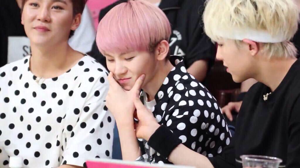 Jihoon drank something strange and bad, soonyoung looks concerned.