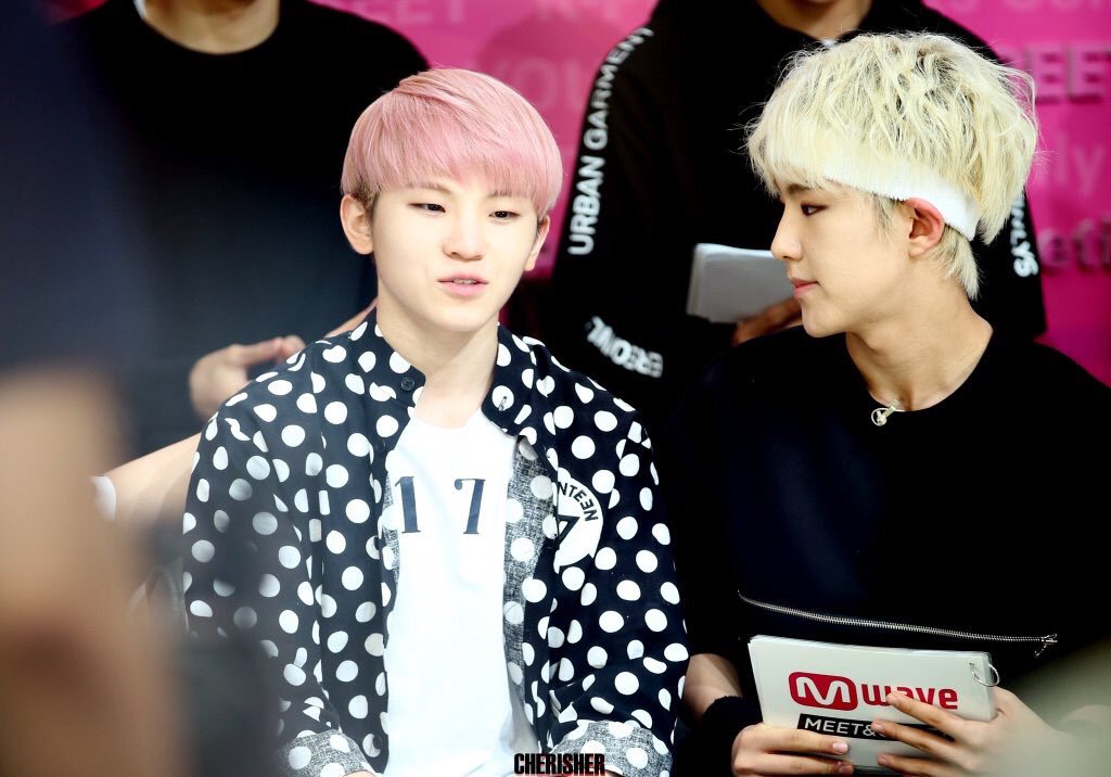 Jihoon drank something strange and bad, soonyoung looks concerned.