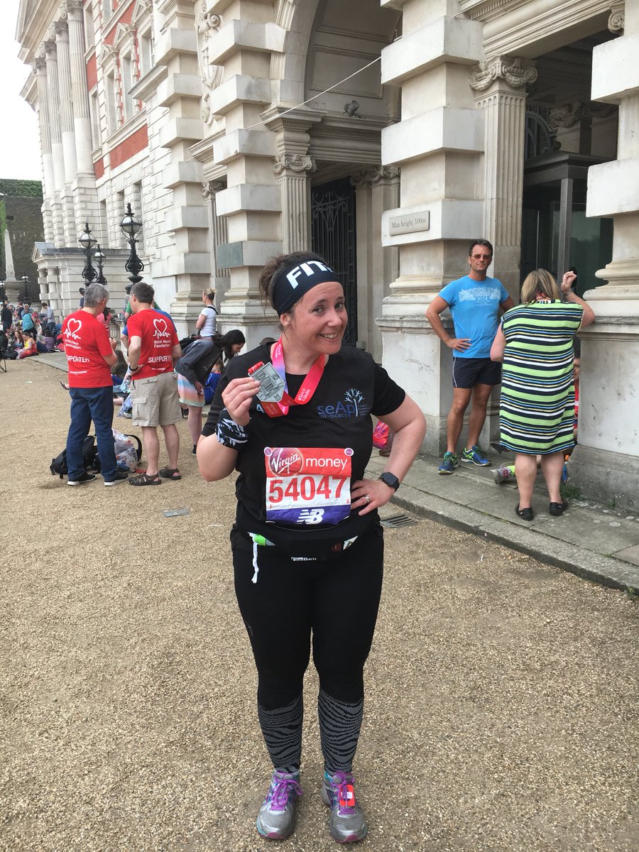 MarieCasey6's tweet photo. The amazing Amy @theVLMfox @seapadvocacy at the end of the Marathon greeted by husband, Pete and proudly showing her medal. An awesome feat completed in 7:08:22 on a hot Sunday. Congratulations to Amy and a massive thank you to all who sponsored her. You can still donate https://t.co/5yL9wP2DSN