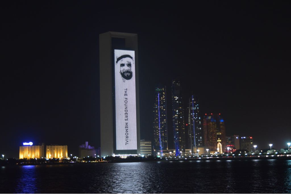ADNOCGroup's tweet photo. #ADNOC headquarters lights up with the late Shiekh Zayed Bin Sultan Al Nahyan's picture on the occasion of the public opening of the #FoundersMemorial https://t.co/Al6D5vSNfH