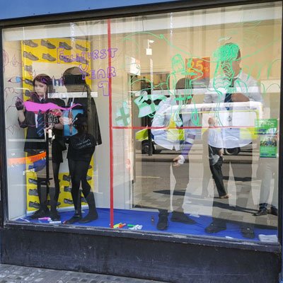 Fullhurst's tweet image. Year 9 Business Studies students worked incredibly hard, despite the heat, on Friday to transform The Schoolwear Centre Leicester window display for #StGeorgesDay @SWS_Uniform  A fantastic eye-catching design! Well done all!