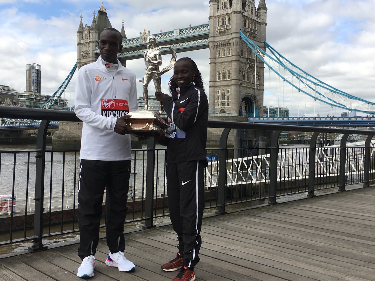 Happening Now: @EliudKipchoge and @VivianCheruiyot celebrate with their trophy for winning the #LondonMarathon.