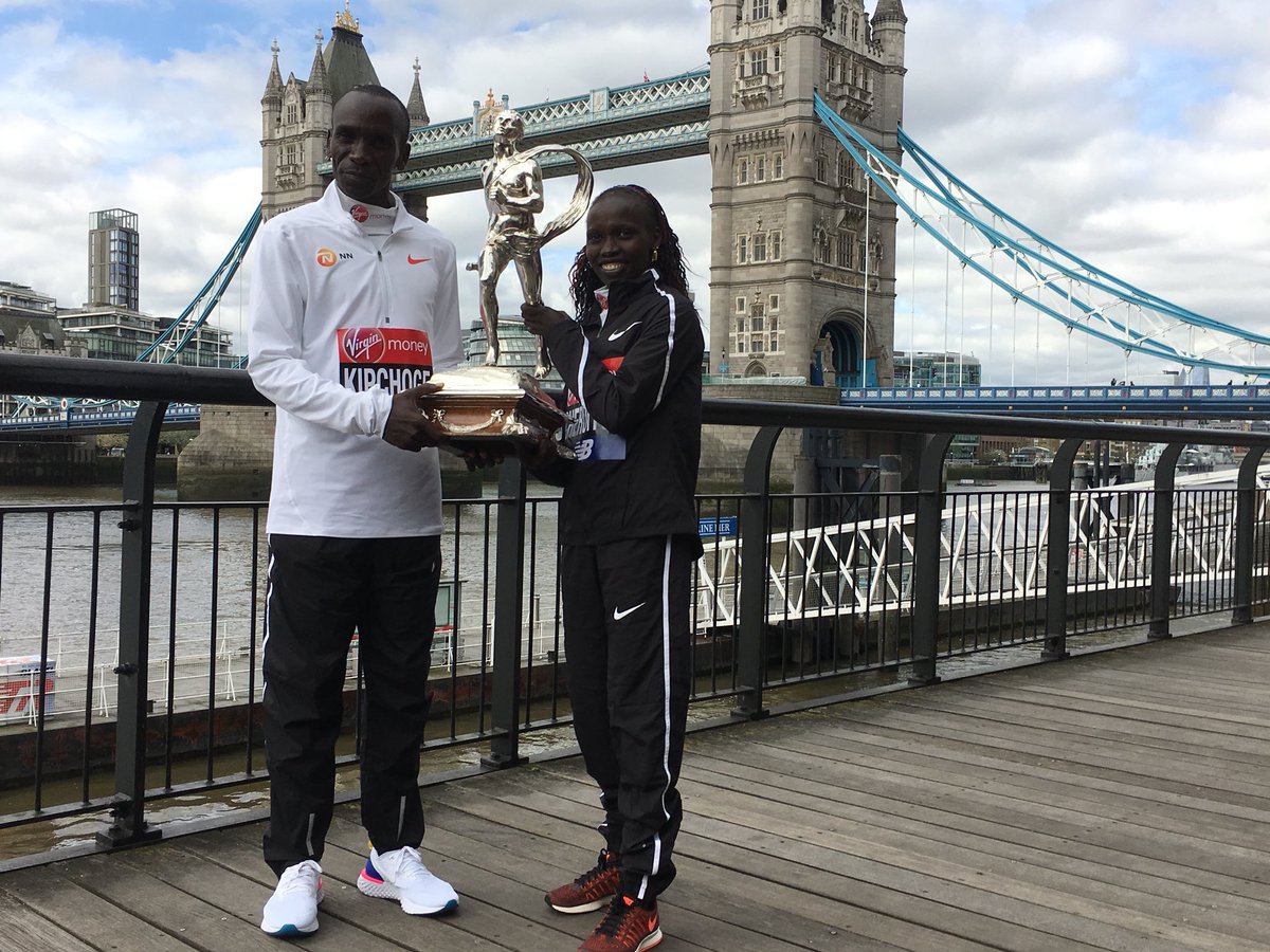 Your 2018 #LondonMararthon winners @EliudKipchoge and @VivianCheruiyot celebrate with their trophy the day after the race.